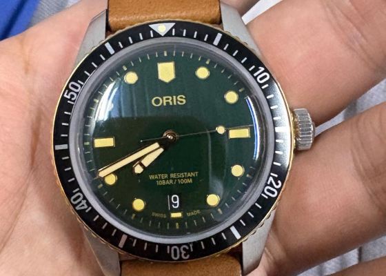 豪利时潜水65周年复刻 青铜圈绿盘胶带